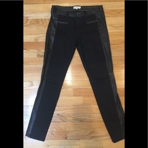 Tory Burch black jeans with leather detail.